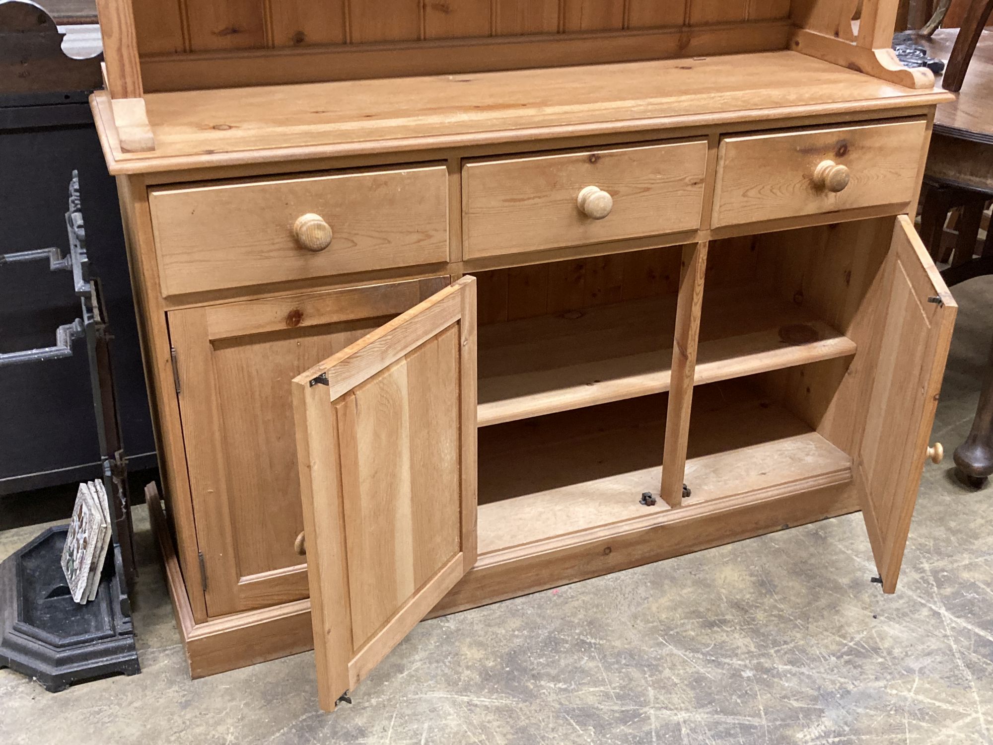 A Victorian style pine dresser, length 137cm, depth 45cm, height 200cm